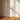 2. SORTERING - Glas lysestage, pink/gul/turkis, 29xø10 cm fra EJA – med tændt lys på spisebord
