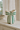 Sløjfe vase med grønne striber fra Kersten, på vintage hvidmalet kommode